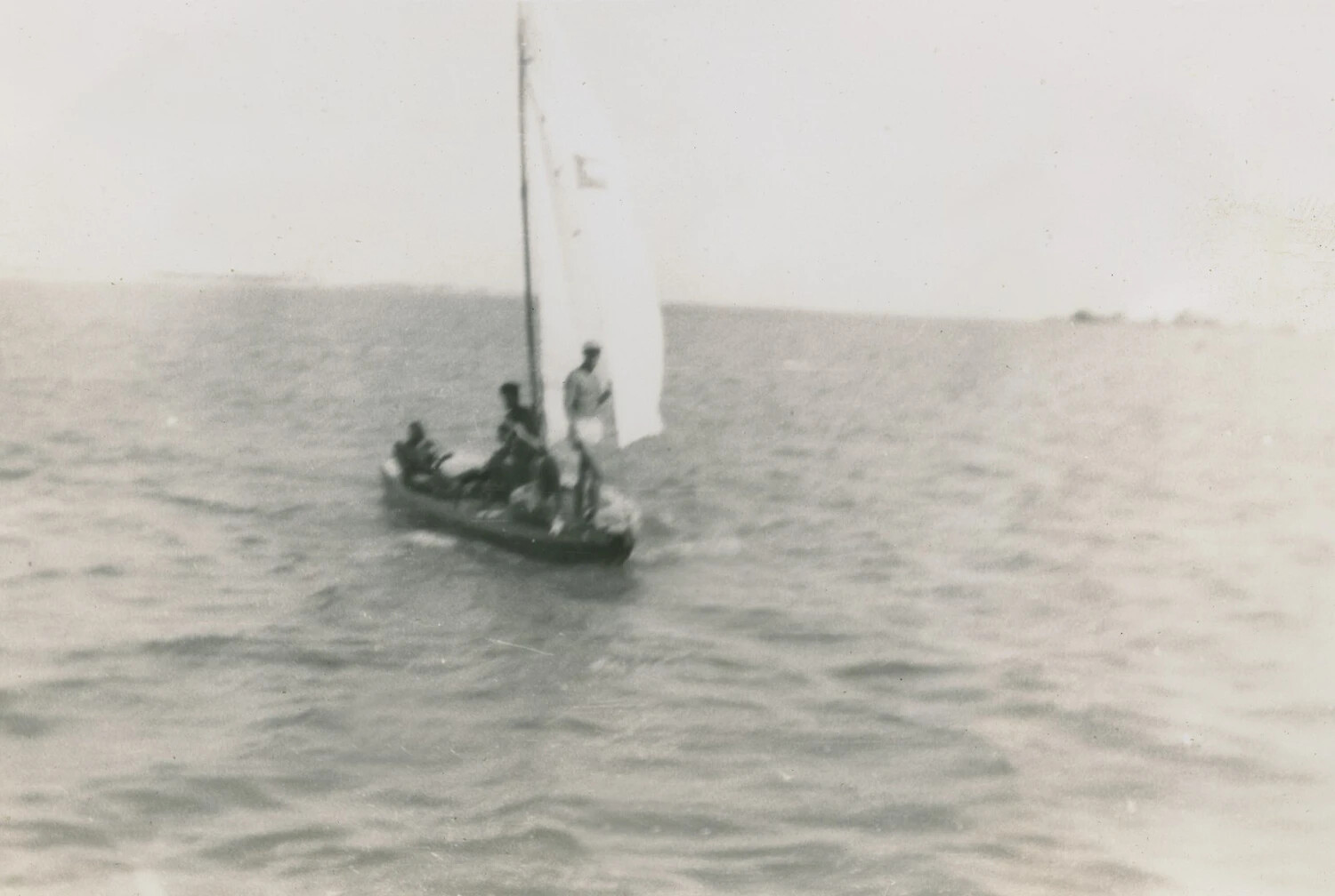 Small Sailboat with Servicemen at Sea, McAleer Photo Album