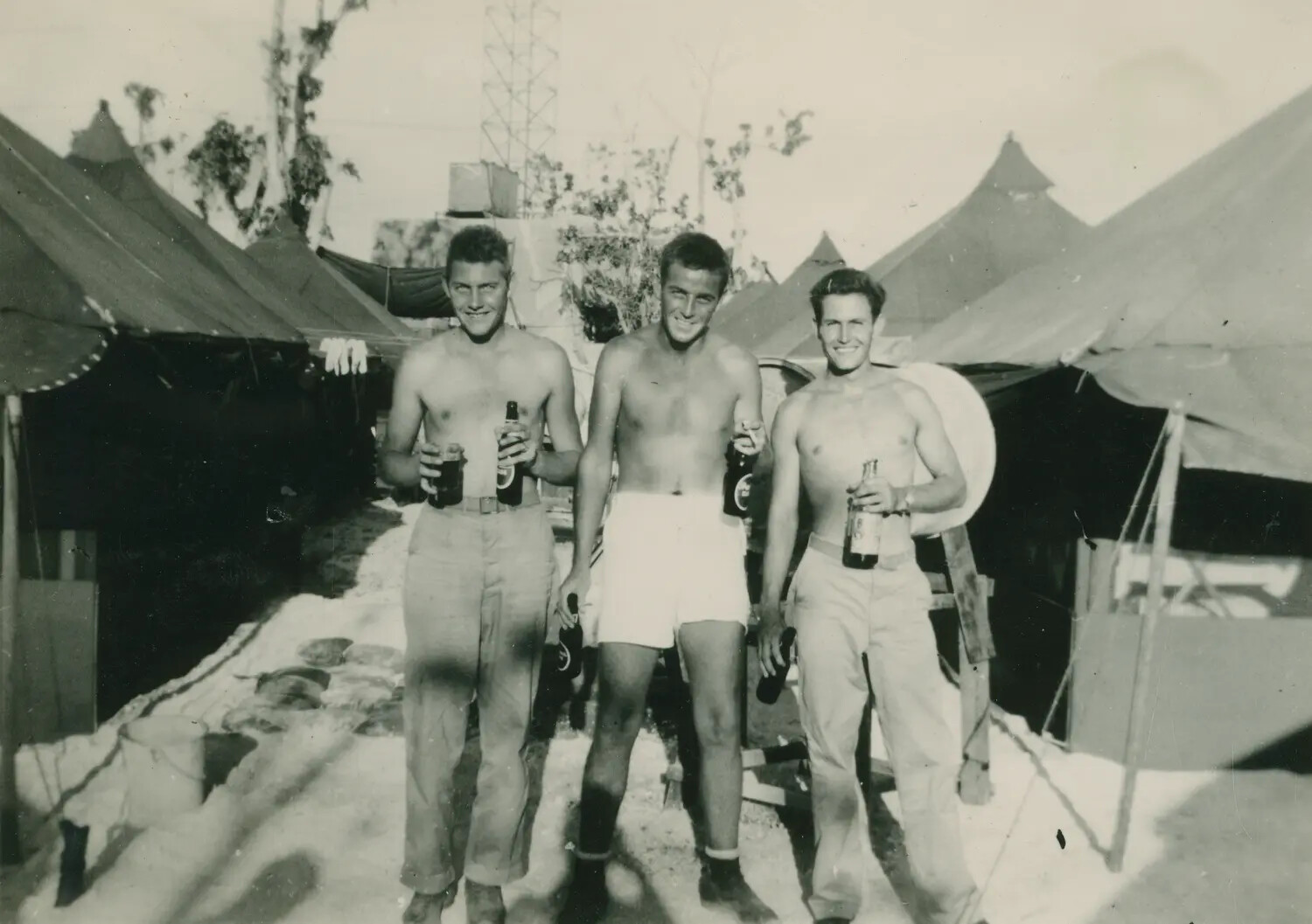 Three Servicemen with Beer Bottles at Tent Camp, McAleer Album