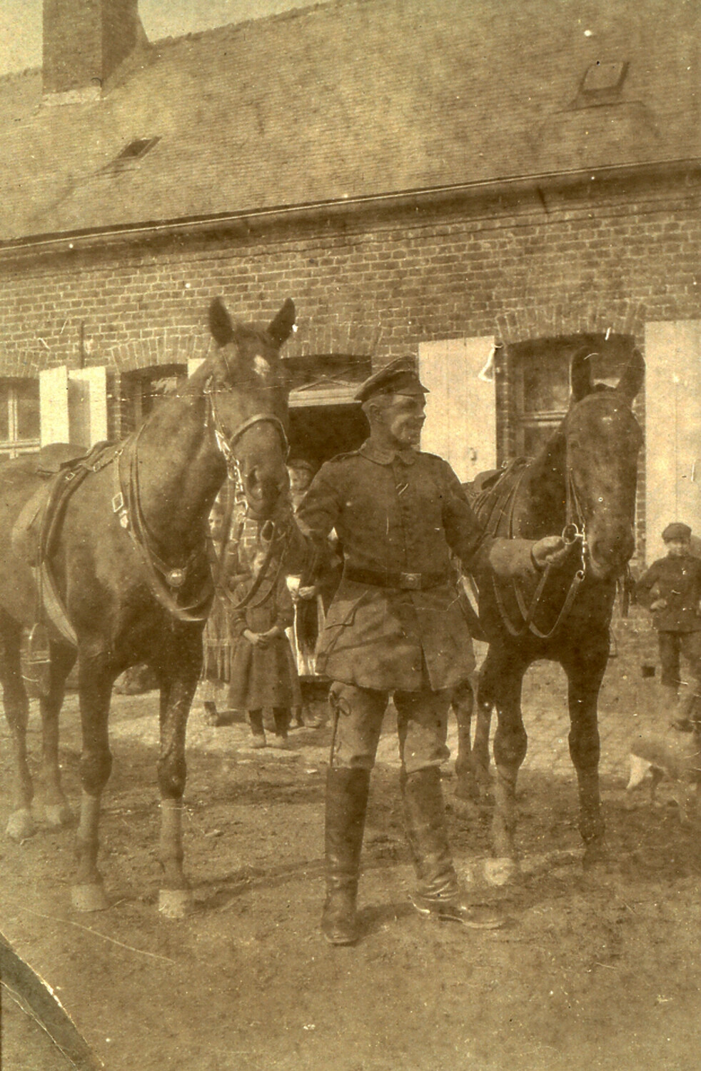German Soldier with Cavalry Horses at a Village Billet, WWI