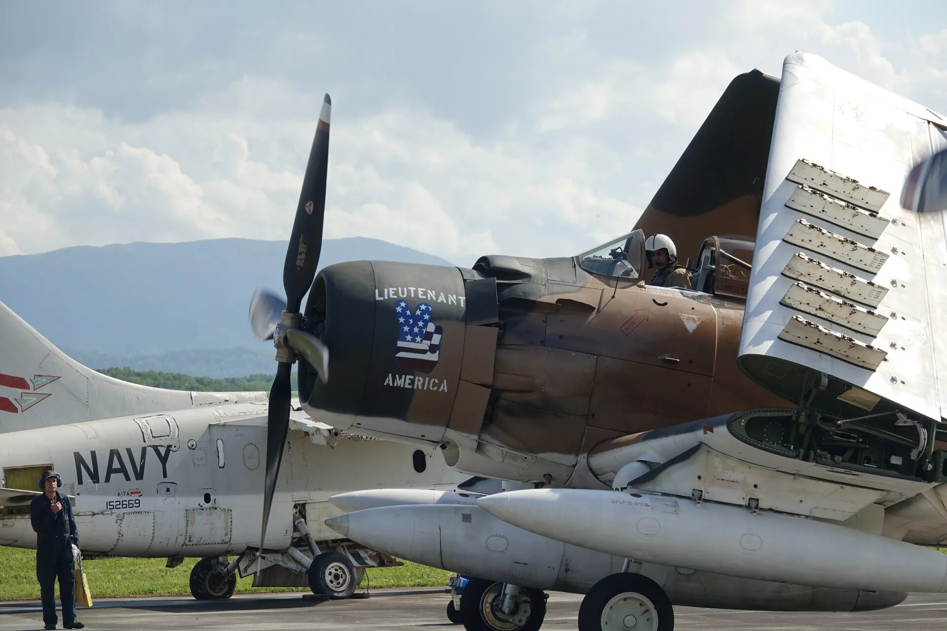 Douglas A-1 Skyraider "Lieutenant America" with Navy A-7A Corsair II, Airshow Ramp
