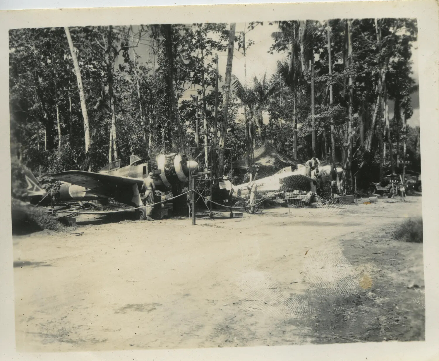 Captured Japanese Fighter Aircraft Under Inspection, Jungle Airfield — 312th Bomb Group Area of Operations