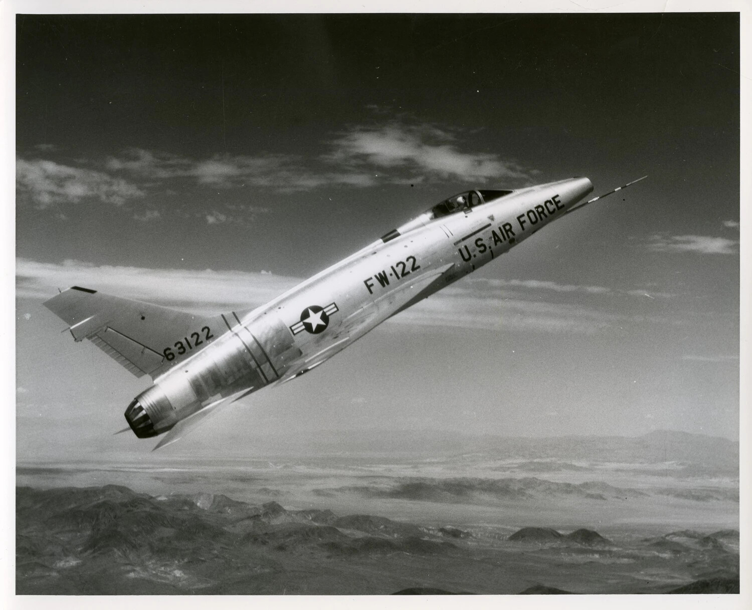 North American F-100D Super Sabre "FW-122" in Climbing Bank Over Desert Terrain