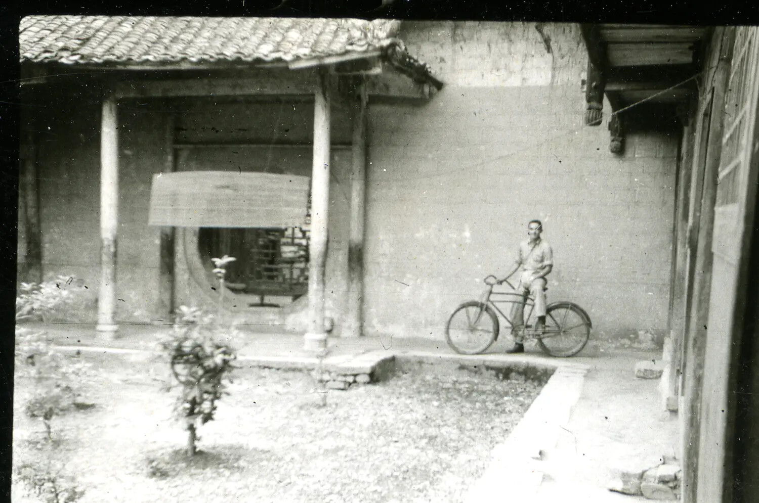 American Serviceman with Bicycle in Chinese Courtyard, CBI Theater, WWII
