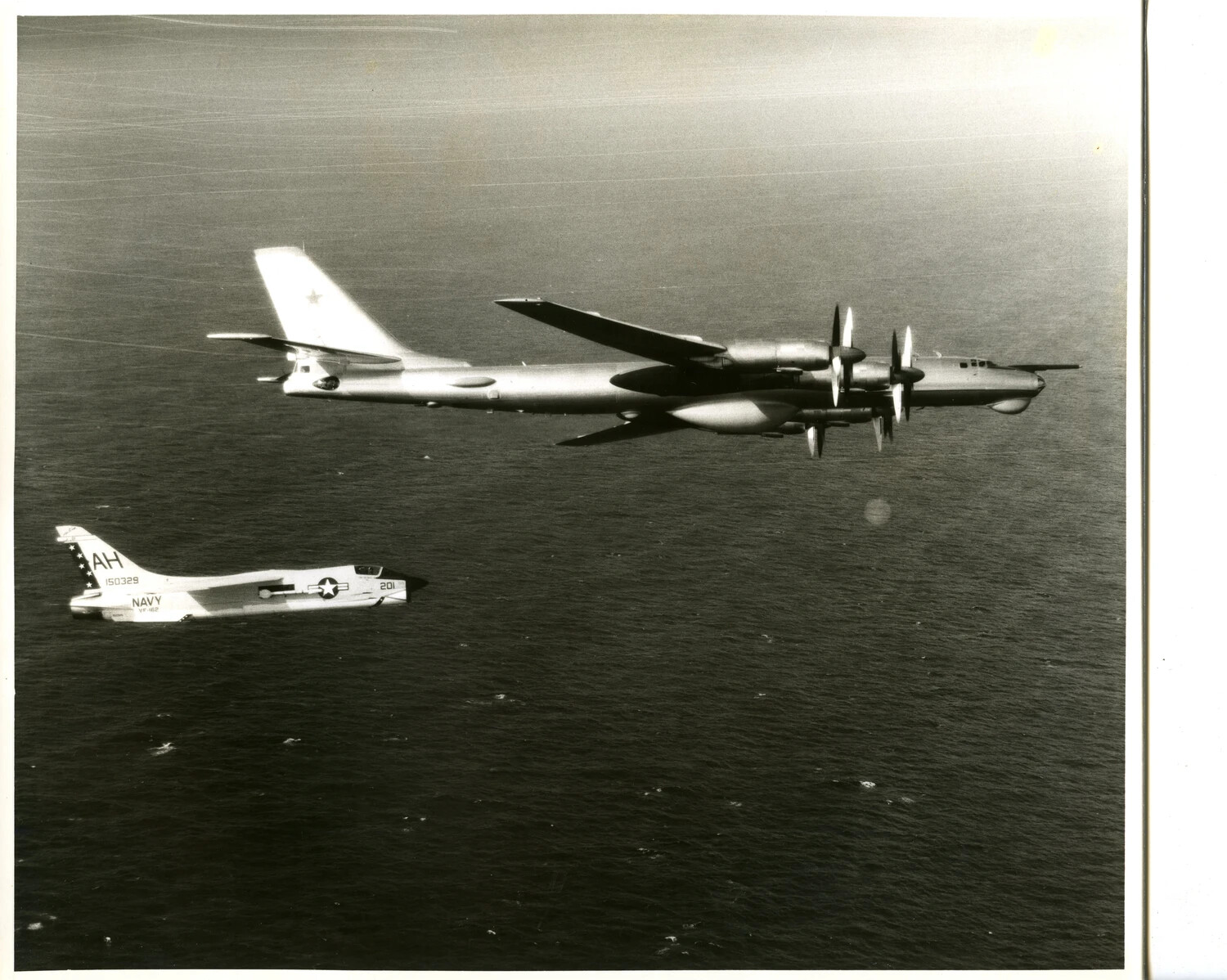 U.S. Navy F-8 Crusader (VF-162) Intercepts Soviet Tu-95 'Bear' Bomber Over the Pacific