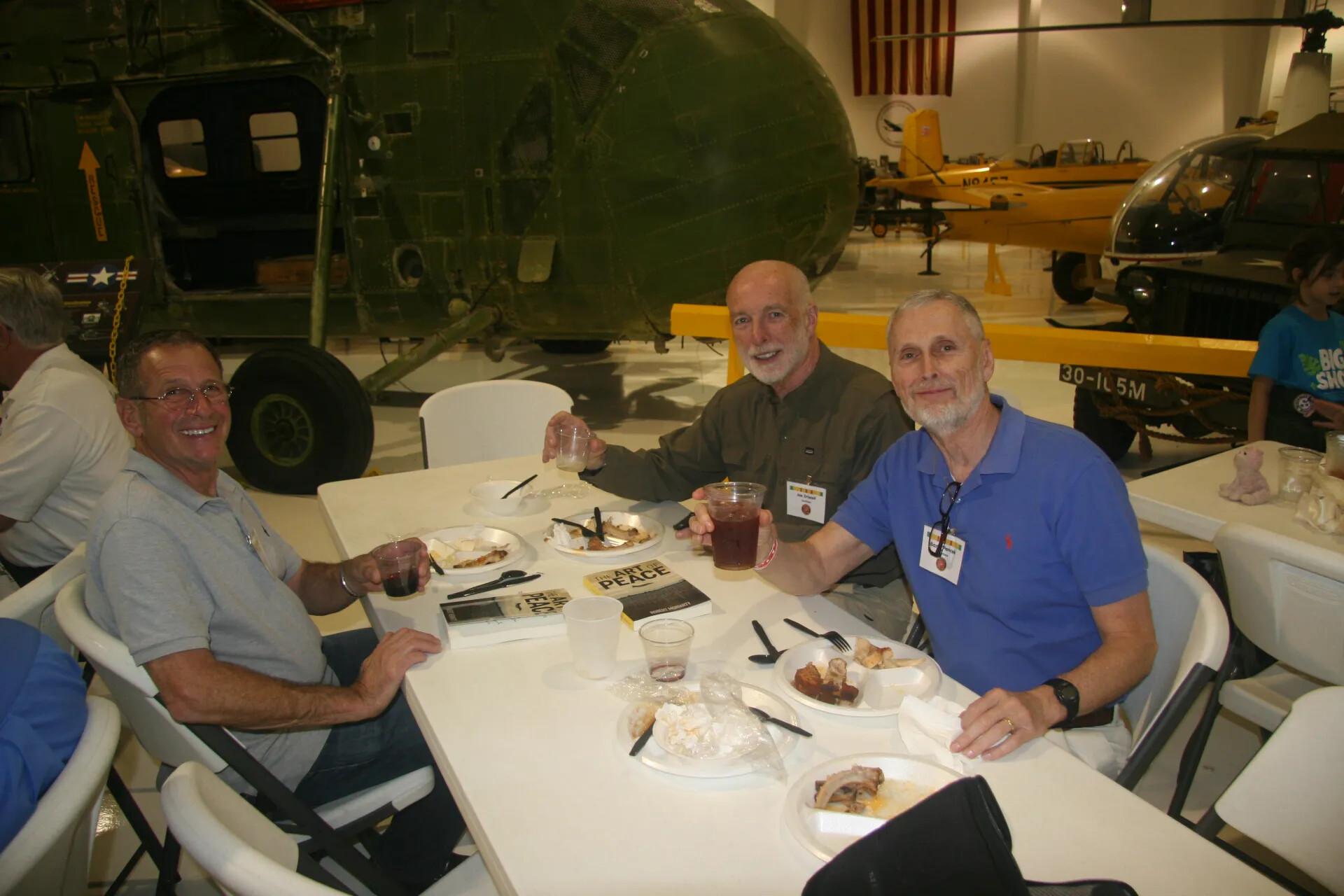 Veterans Sharing a Meal at Reunion Luncheon, Aviation Museum Hangar