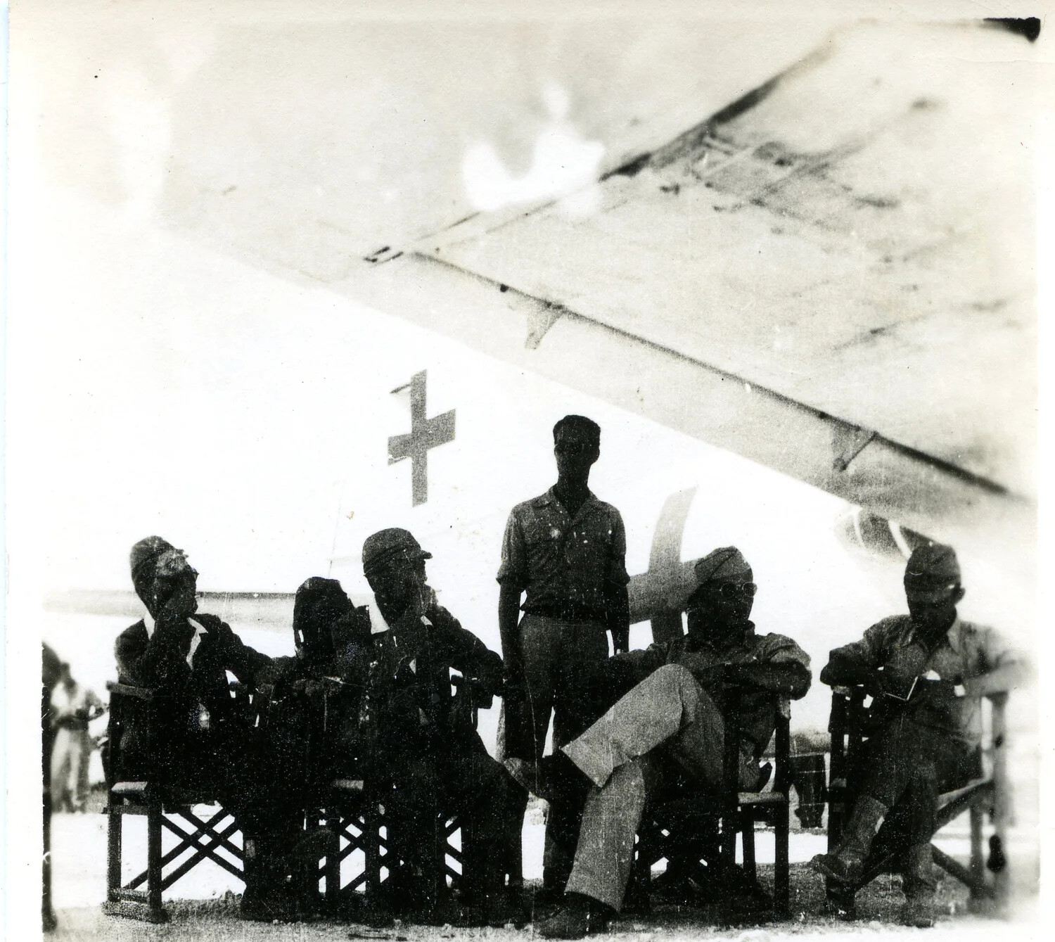 Japanese Surrender Envoy Delegation Beneath Green-Cross Marked Aircraft, Ie Shima, August 1945