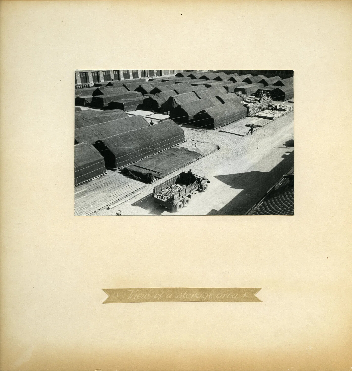 Album Page: 'View of a Storage Area' - Aerial View of Tent Depot, U.S. Army Quartermaster Installation, Germany