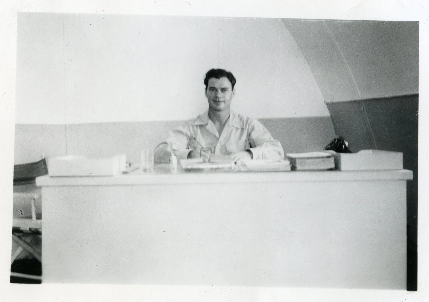U.S. Navy Serviceman at Office Desk, Quonset Hut Interior, NAS Agana, Guam