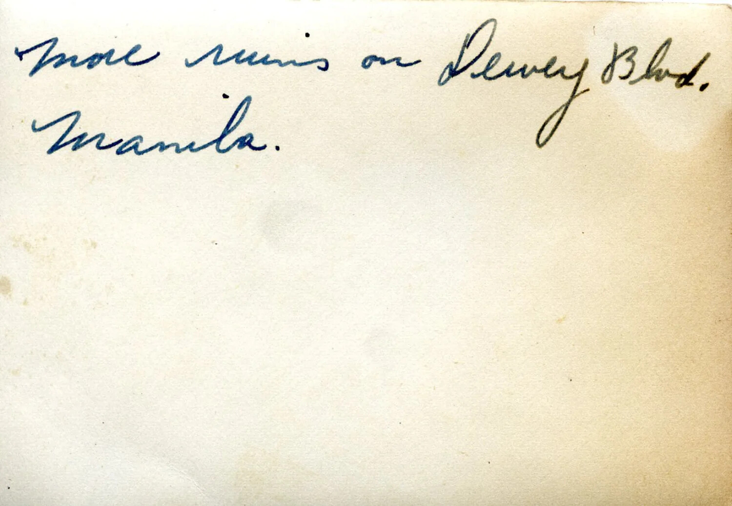 Verso of Photograph with Handwritten Caption: "More Ruins on Dewey Blvd. Manila"