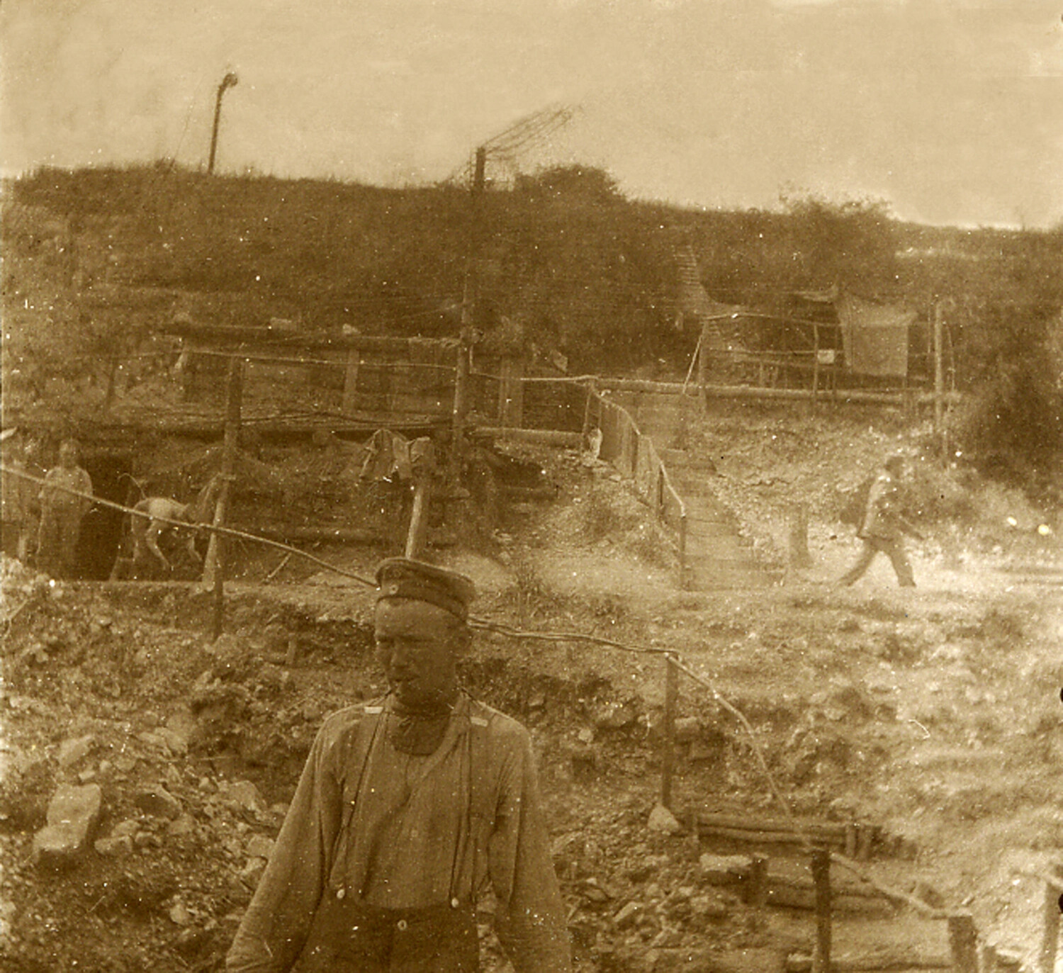 German Soldier in Trench Position with Timber Revetments and Wire, World War I