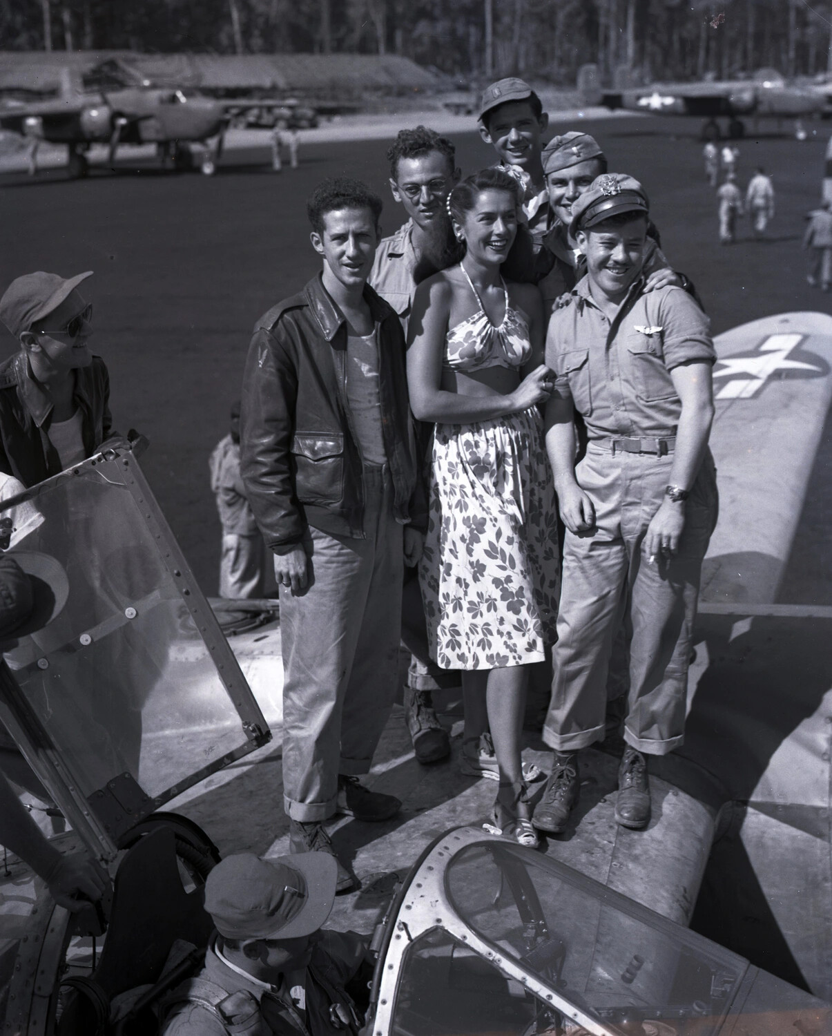Airmen Pose with Visiting Entertainer on Aircraft Wing, Myitkyina, Burma, WWII CBI Theater