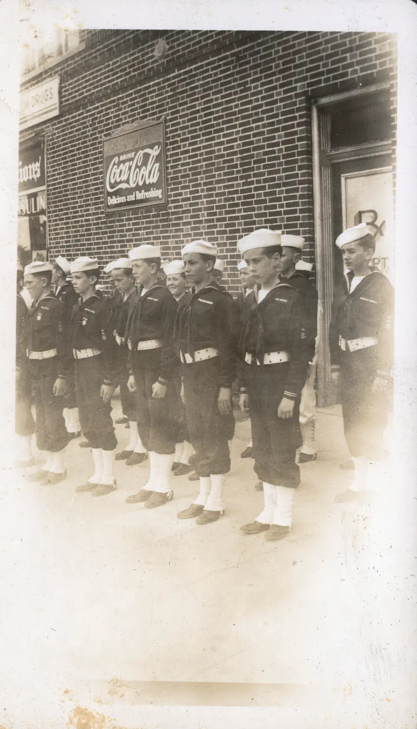 Youth Naval Cadet Formation Outside a Drugstore, WWII-Era Stateside Parade