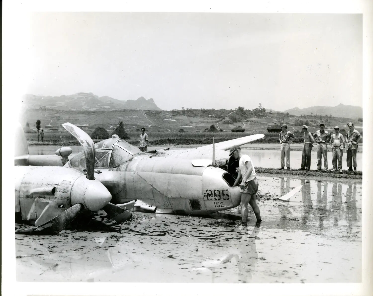 Crash-Landed U.S. Fighter Aircraft in Flooded Rice Paddy, China-Burma-India Theater, WWII