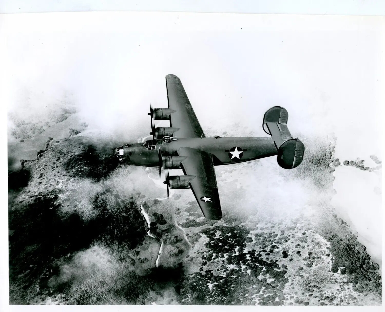 Consolidated B-24 Liberator Heavy Bomber Banking Over Terrain, WWII