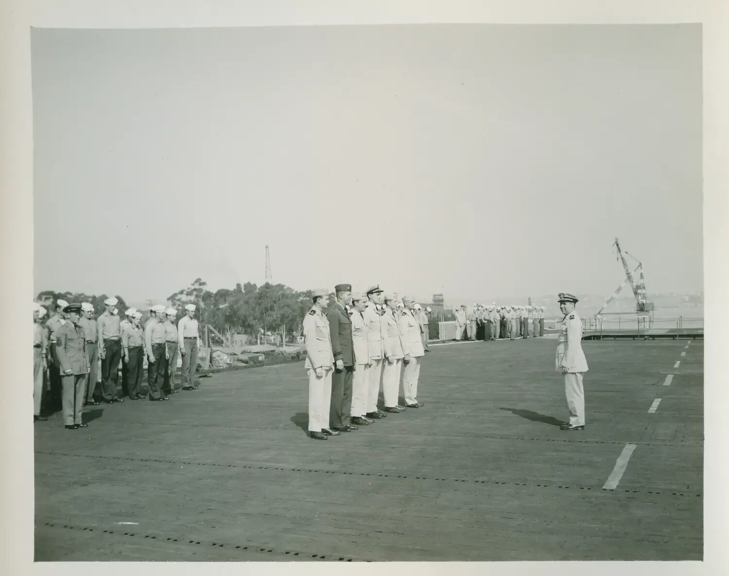 Formal Deck Ceremony Aboard USS Petrof Bay (CVE-80) in Port, WWII Era