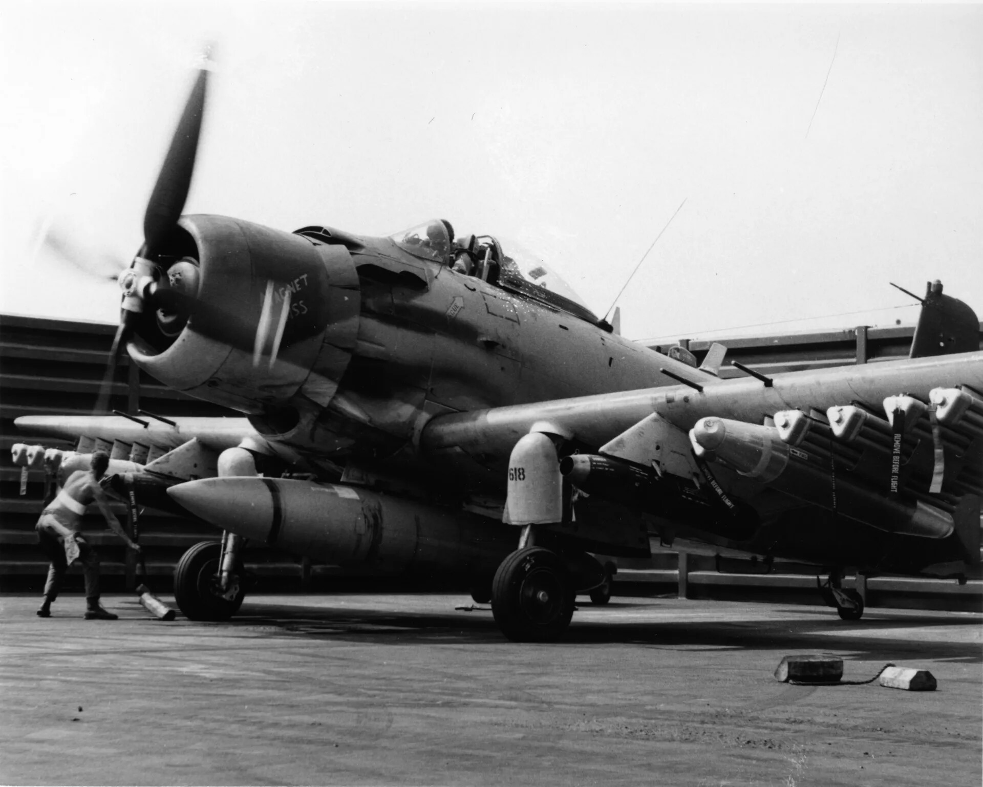 Crew Chief Pulls Chocks from A-1 Skyraider "Magnet Ass" (618) Prior to Taxi, Vietnam War