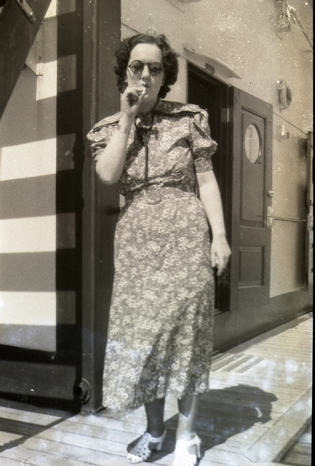 Woman on Ship's Deck in Floral Dress with Cigarette Holder, Mid-1930s