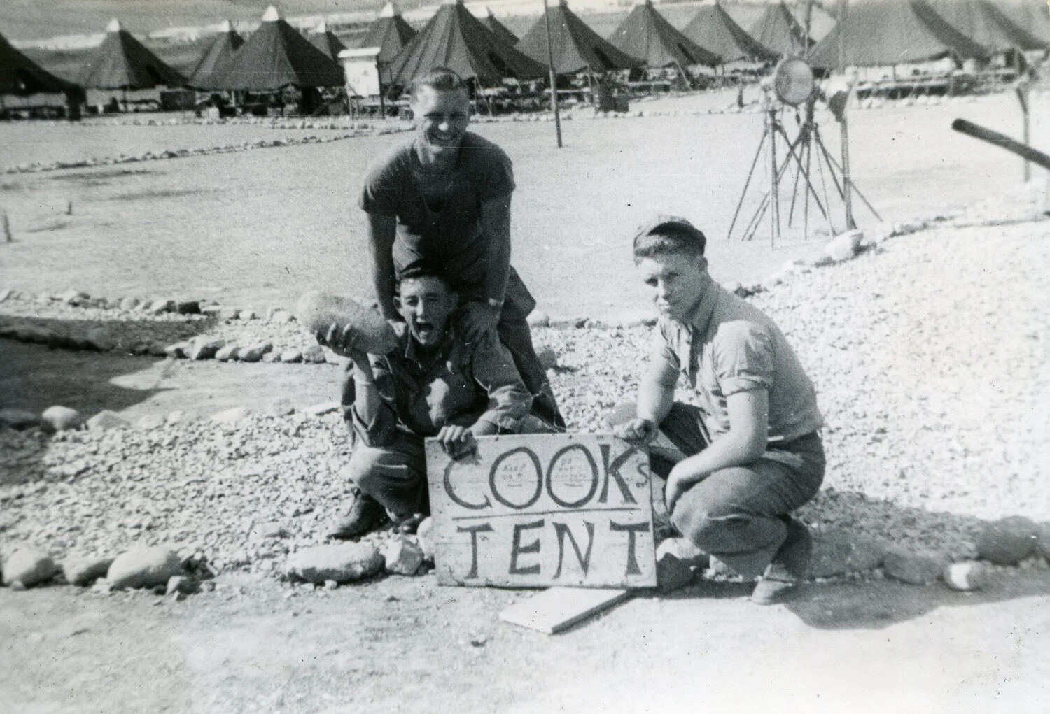 Marines Clowning by 'Cooks Tent' Sign, VMF-214 Squadron Camp, 1945