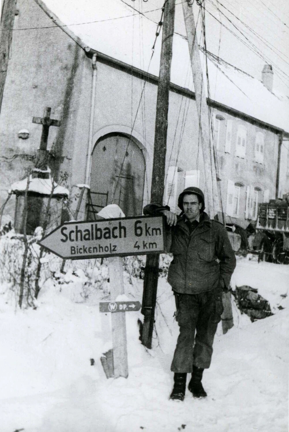 American Soldier at Village Road Sign for Schalbach and Bickenholz, Alsace-Lorraine, Winter 1944-45