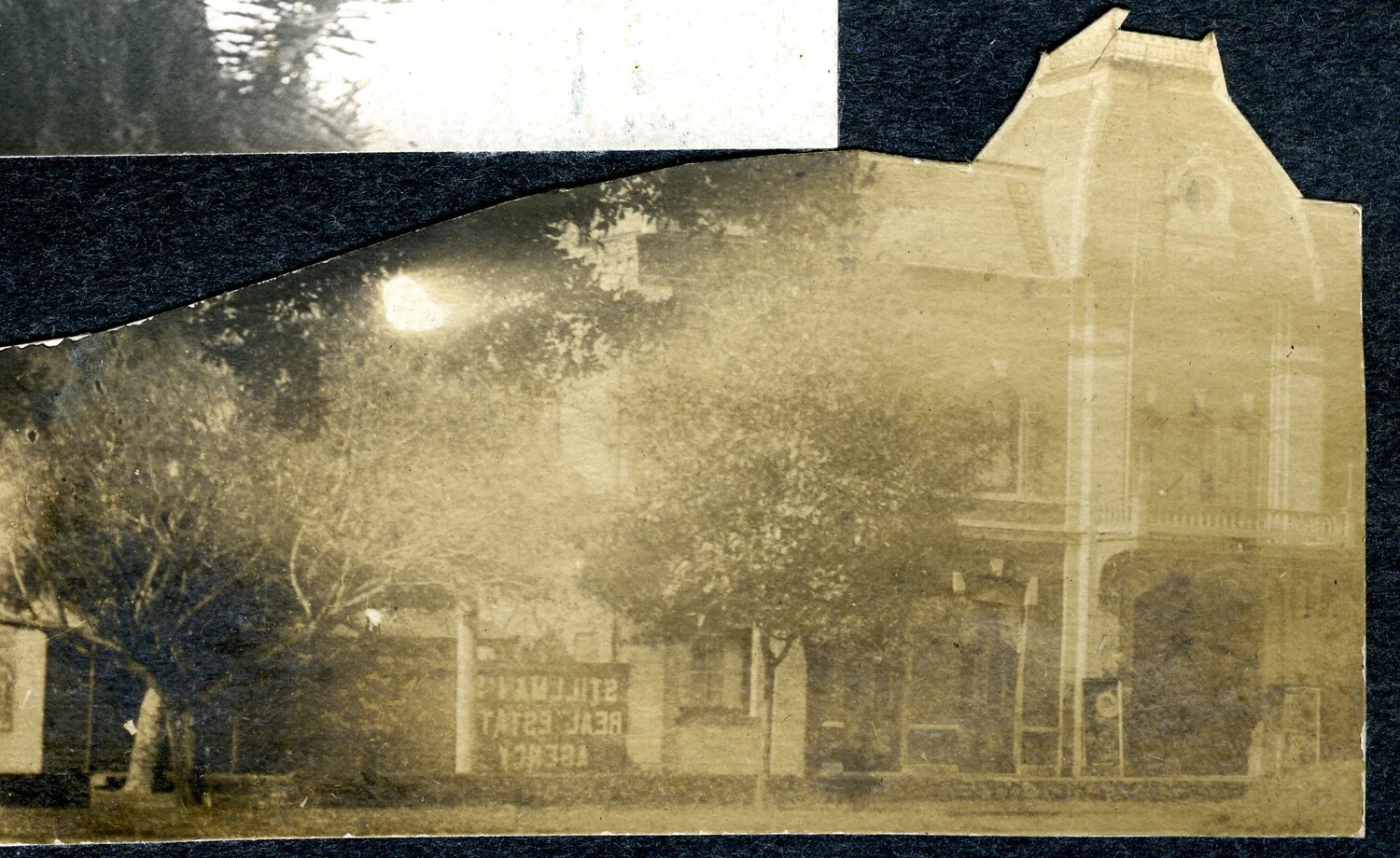 Street View with 'Stillman's Real Estate Agency' Sign, Torn Album Page, USS Columbia Album, c. 1898-1910s