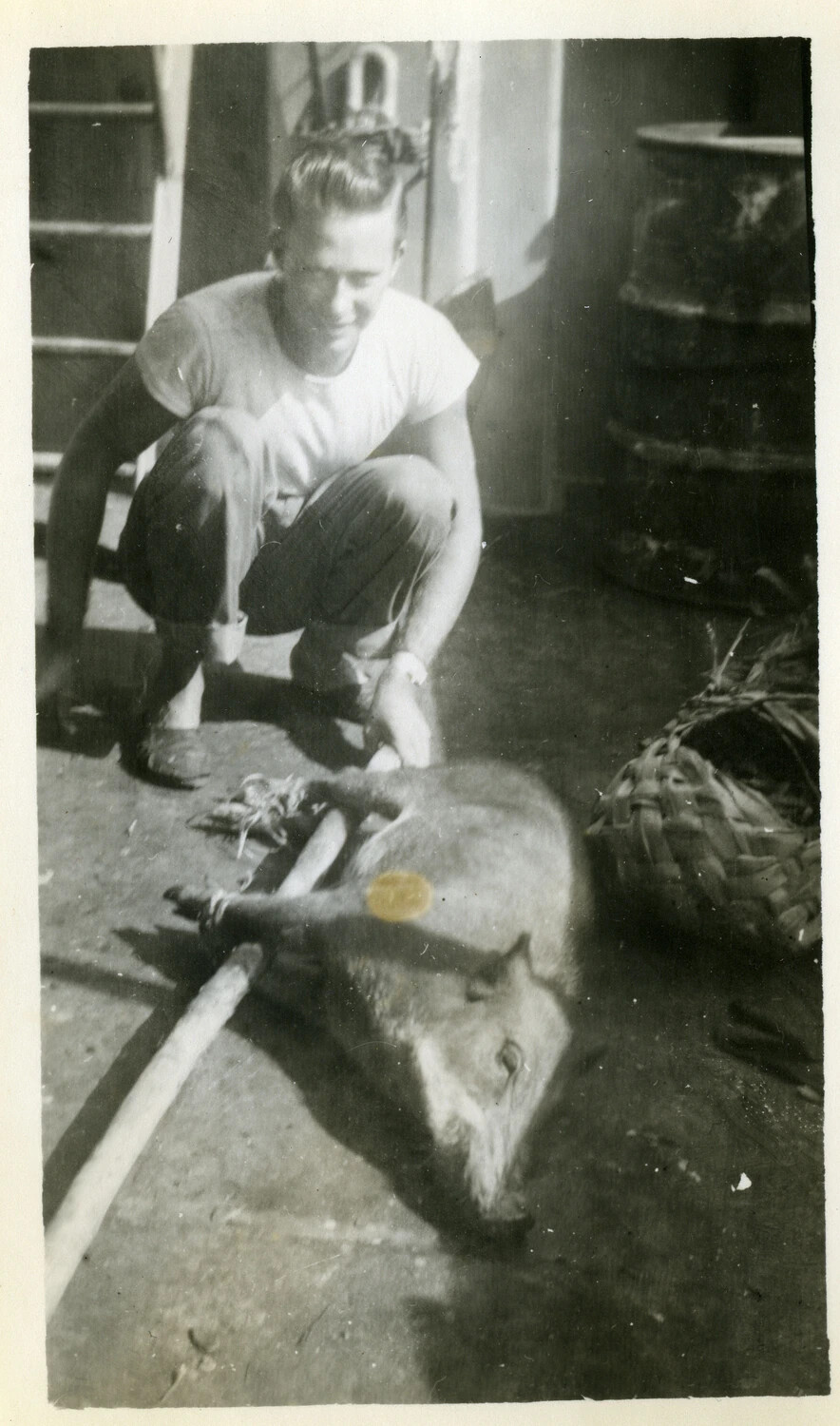 Serviceman Posing with a Hunted Wild Boar, Pacific Theater, World War II