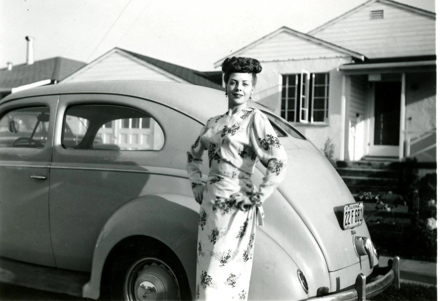 Woman Posing Beside Sedan Outside Suburban Home, California, Mid-1940s