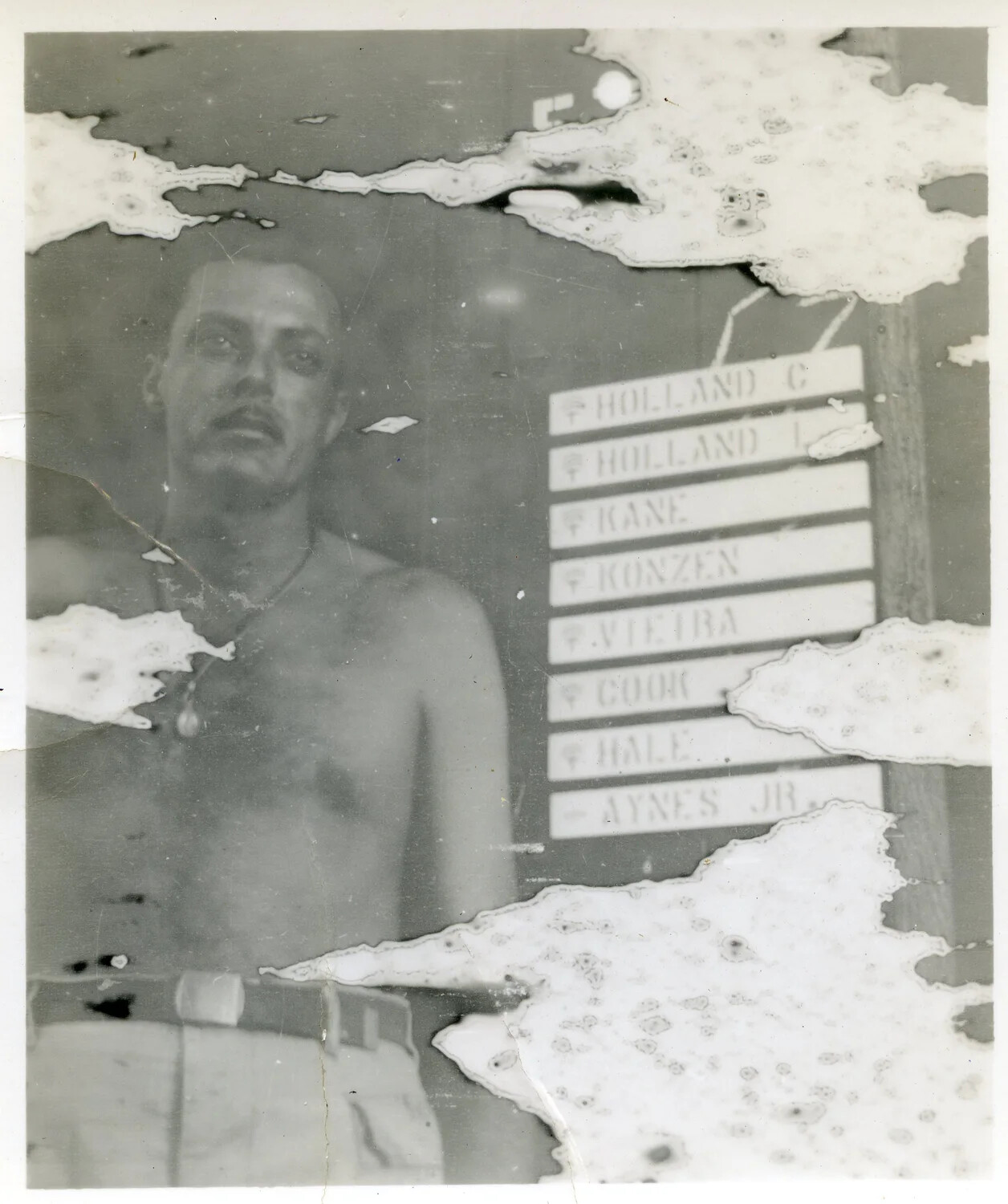 Serviceman Beside Berth Assignment Nameplate Listing 'Vieira' and Crewmates, World War II Era