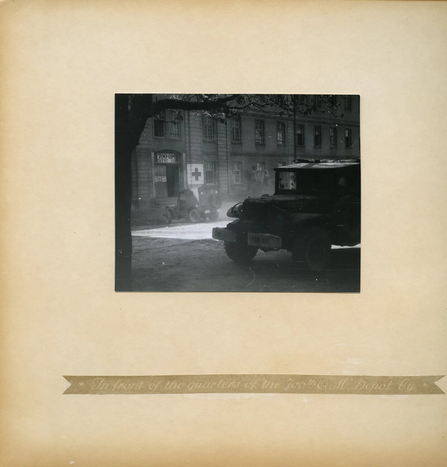 Album Page: 'In Front of the Quarters of the 700th Q.M. Depot Cy.' - Billet Building, Germany
