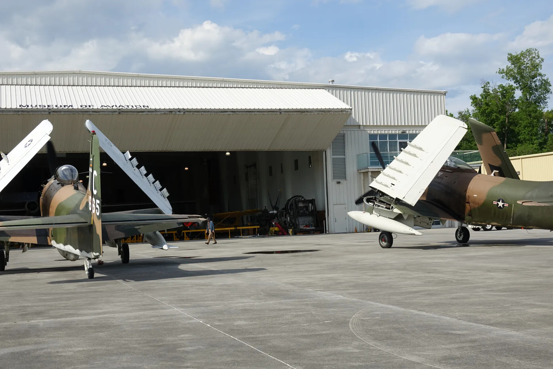 Two A-1 Skyraiders with Folded Wings on Ramp at Museum of Aviation, May 2019