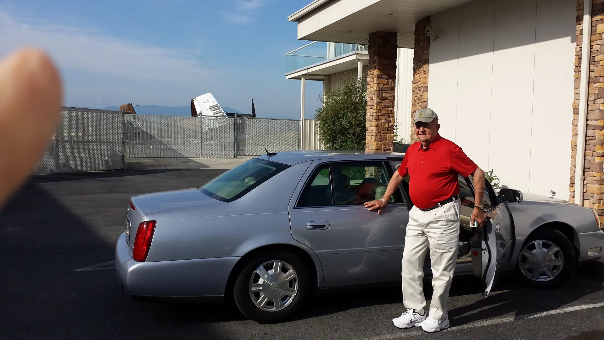 Candid Snapshot of Man Beside Cadillac Sedan at Tennessee Air Museum, June 7, 2014