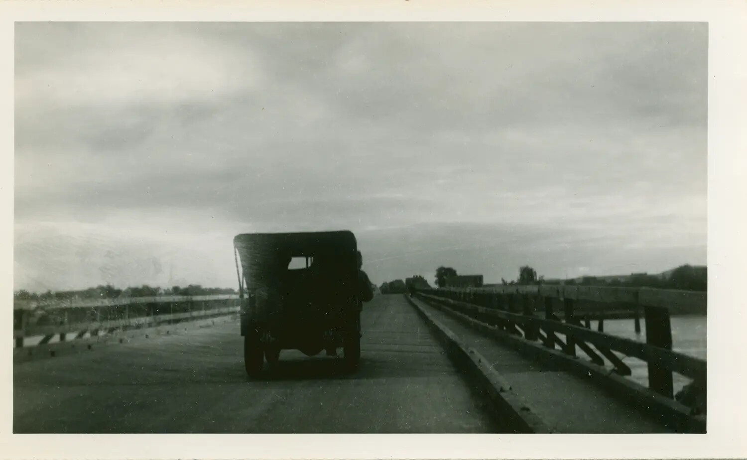 Military Truck Crossing Wooden Trestle Bridge — Capt. Arthur F. Gullo WWII Collection