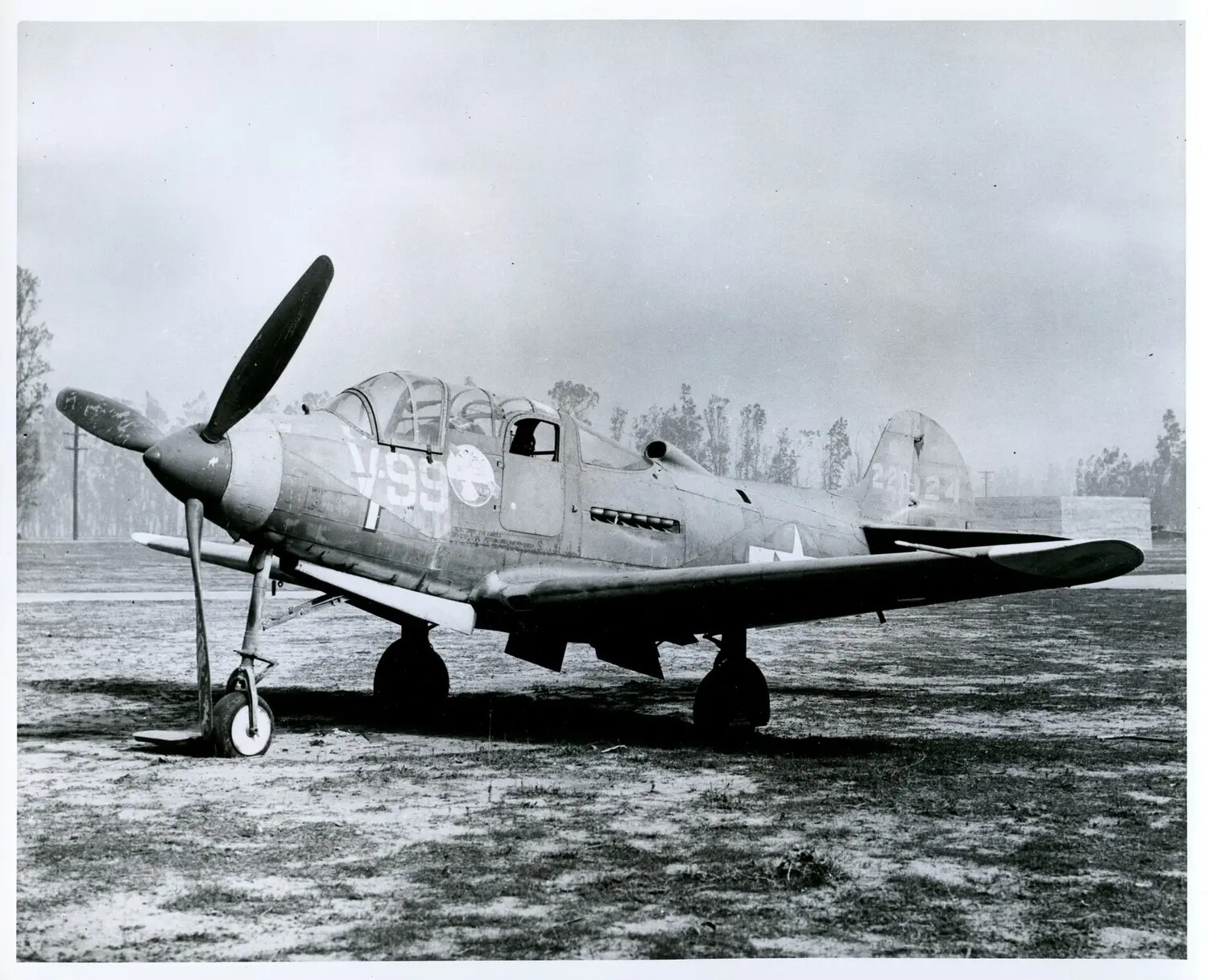 Bell P-39 Airacobra Fighter, Fuselage Code "V-99," on Airfield