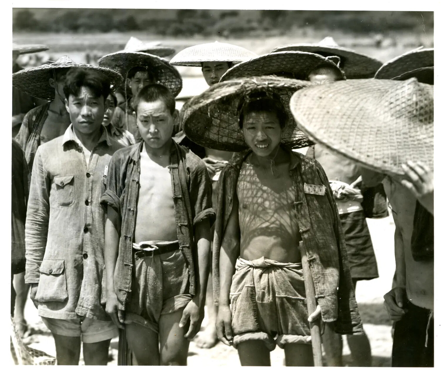 Group Portrait of Local Laborers Wearing Conical Hats, WWII China-Burma-India Theater