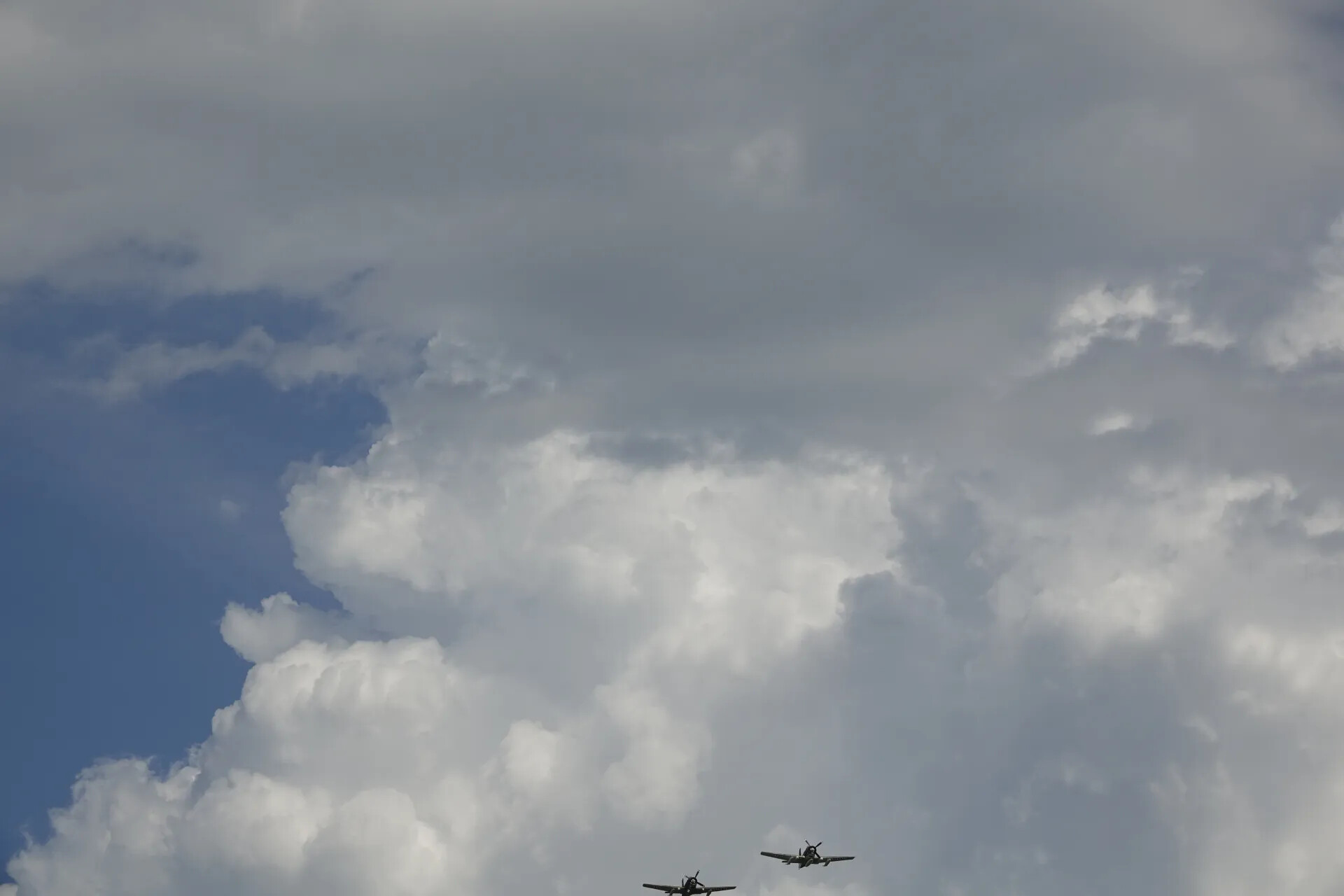 Two Warbirds in Formation Flight Against Cumulus Clouds, May 2019 Event