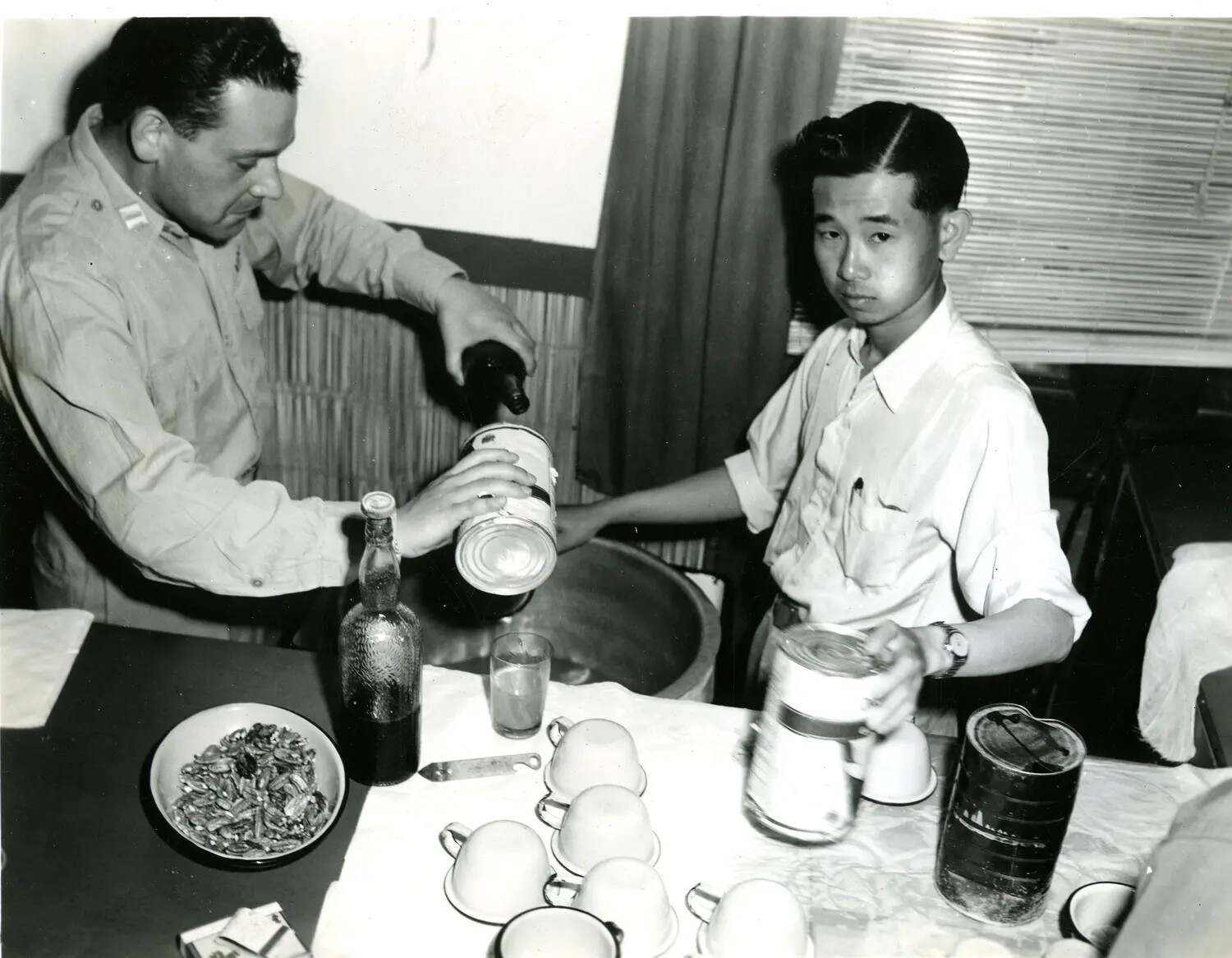 American Serviceman and Local Assistant Preparing Provisions, China-Burma-India Theater, World War II