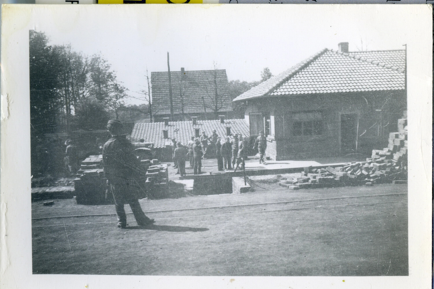 101st Airborne Division Soldiers Outside European Buildings Under Repair, WWII
