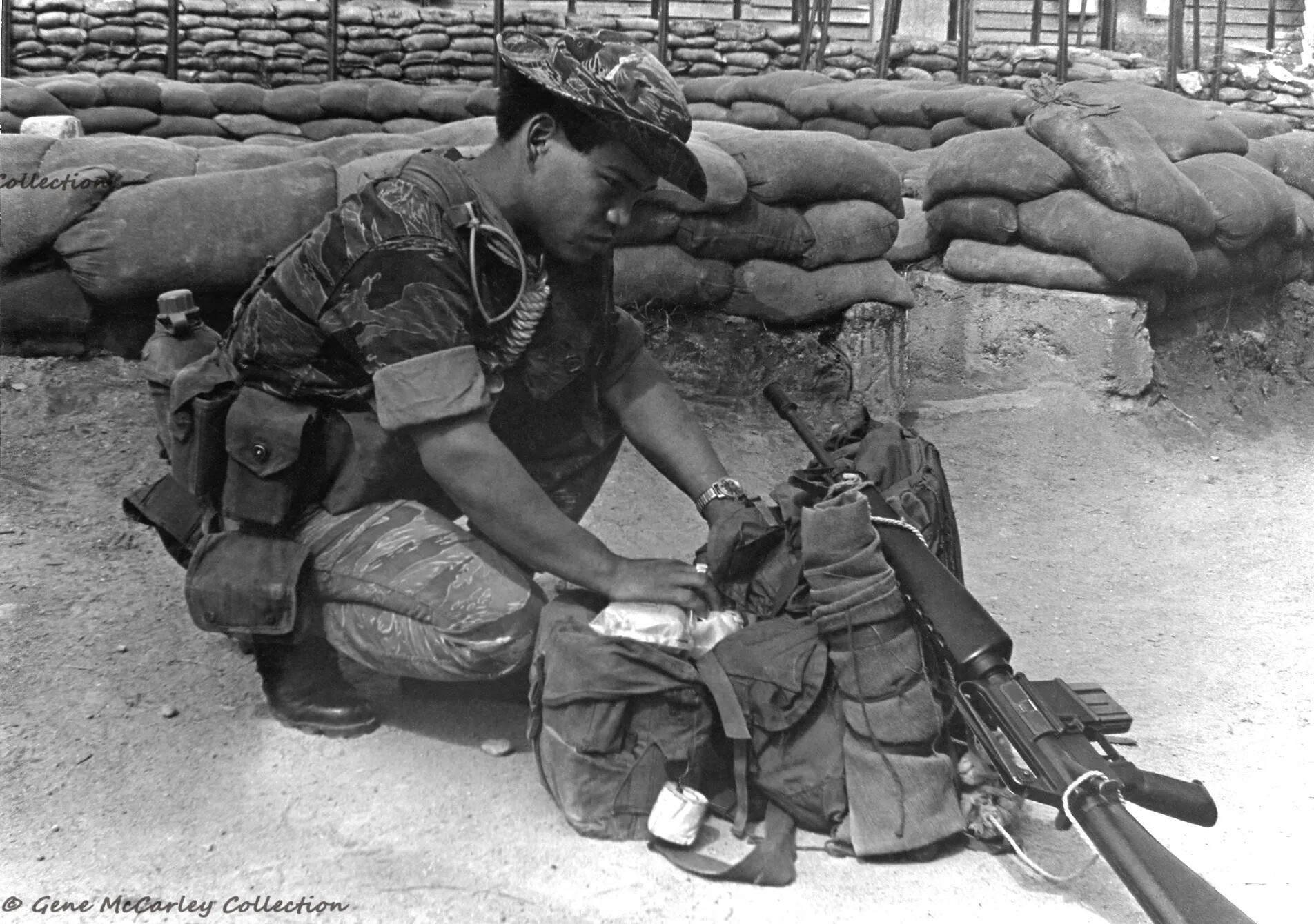 Indigenous MACV-SOG Team Member Packing Gear at Forward Base, Gene McCarley Collection