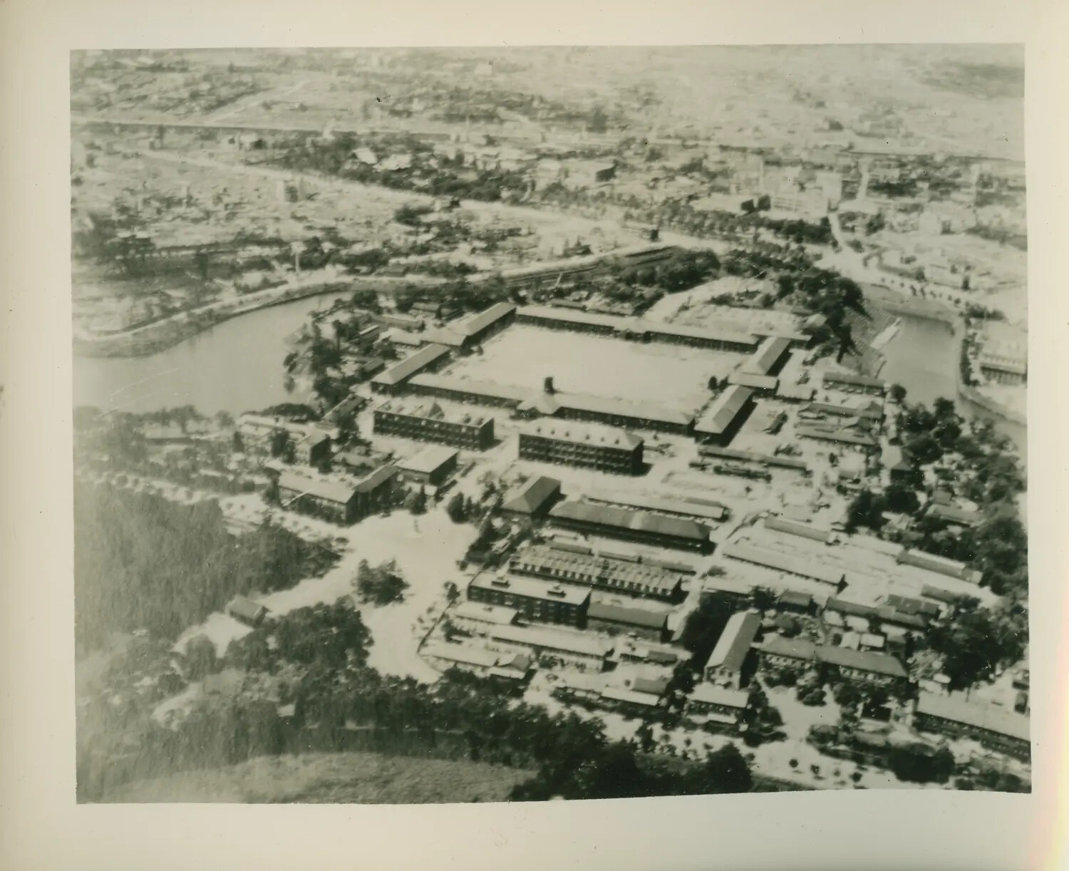 WWII Aerial Reconnaissance Photograph of a Military/Industrial Compound Near a River, Pacific Theater (USS Petrof Bay Collection)