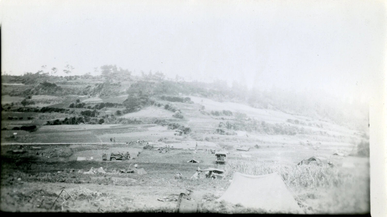 U.S. Military Bivouac in Terraced Hillside Terrain, Likely Okinawa, 1945 (Companion View)