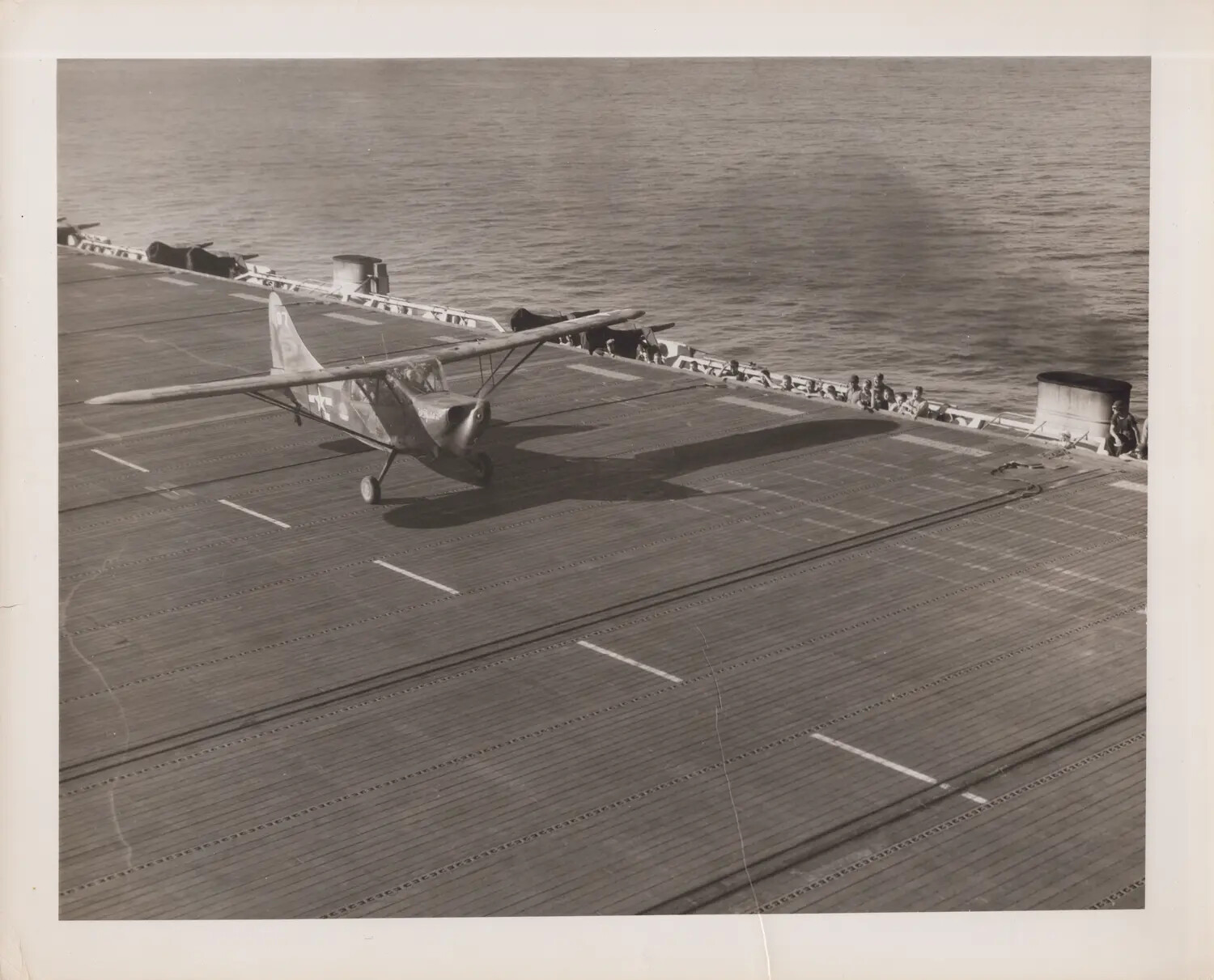 Liaison Aircraft on Flight Deck of U.S. Navy Escort Carrier, WWII Pacific Theater