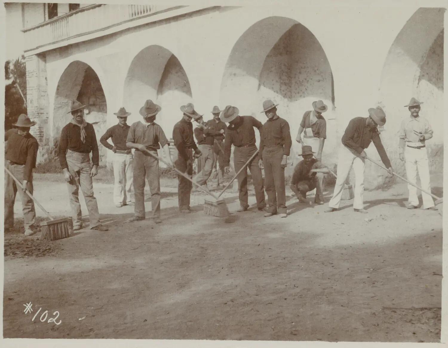 American Soldiers on Grounds-Keeping Detail Before an Arcaded Colonial Building, c. 1898-1902