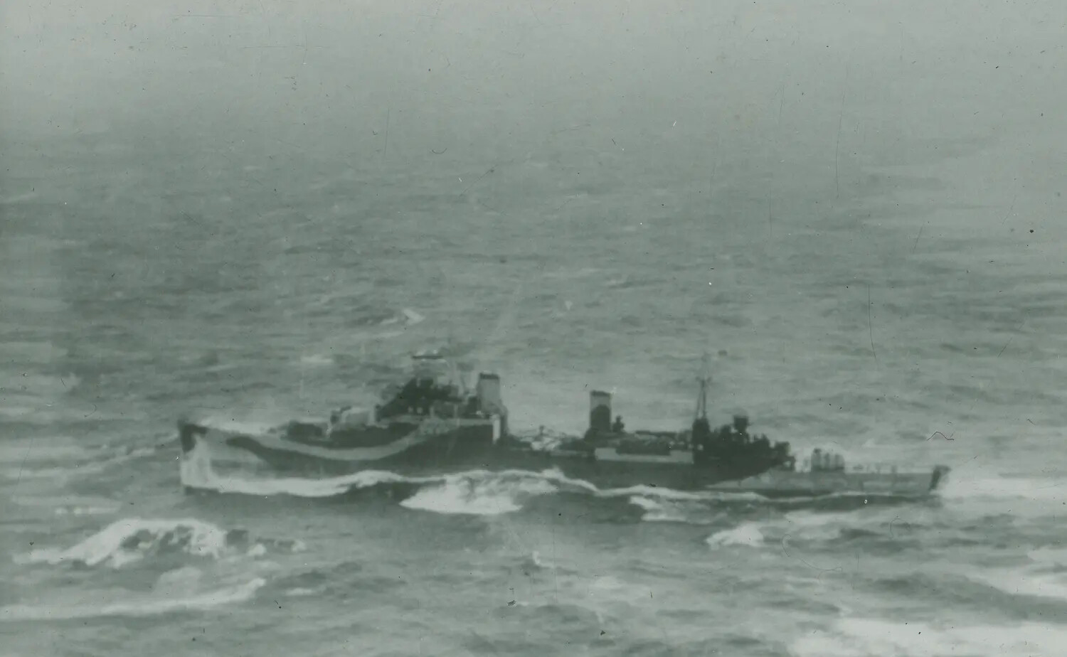 World War II-Era Destroyer Underway in Heavy Seas