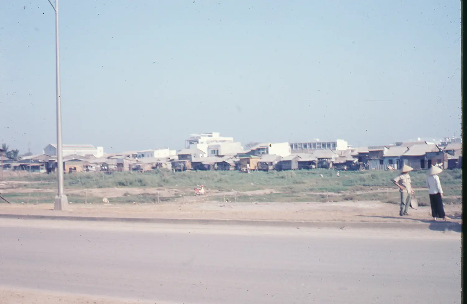 Vietnamese Townscape with Civilians in Conical Hats, 1968 Tet Offensive Era Slide