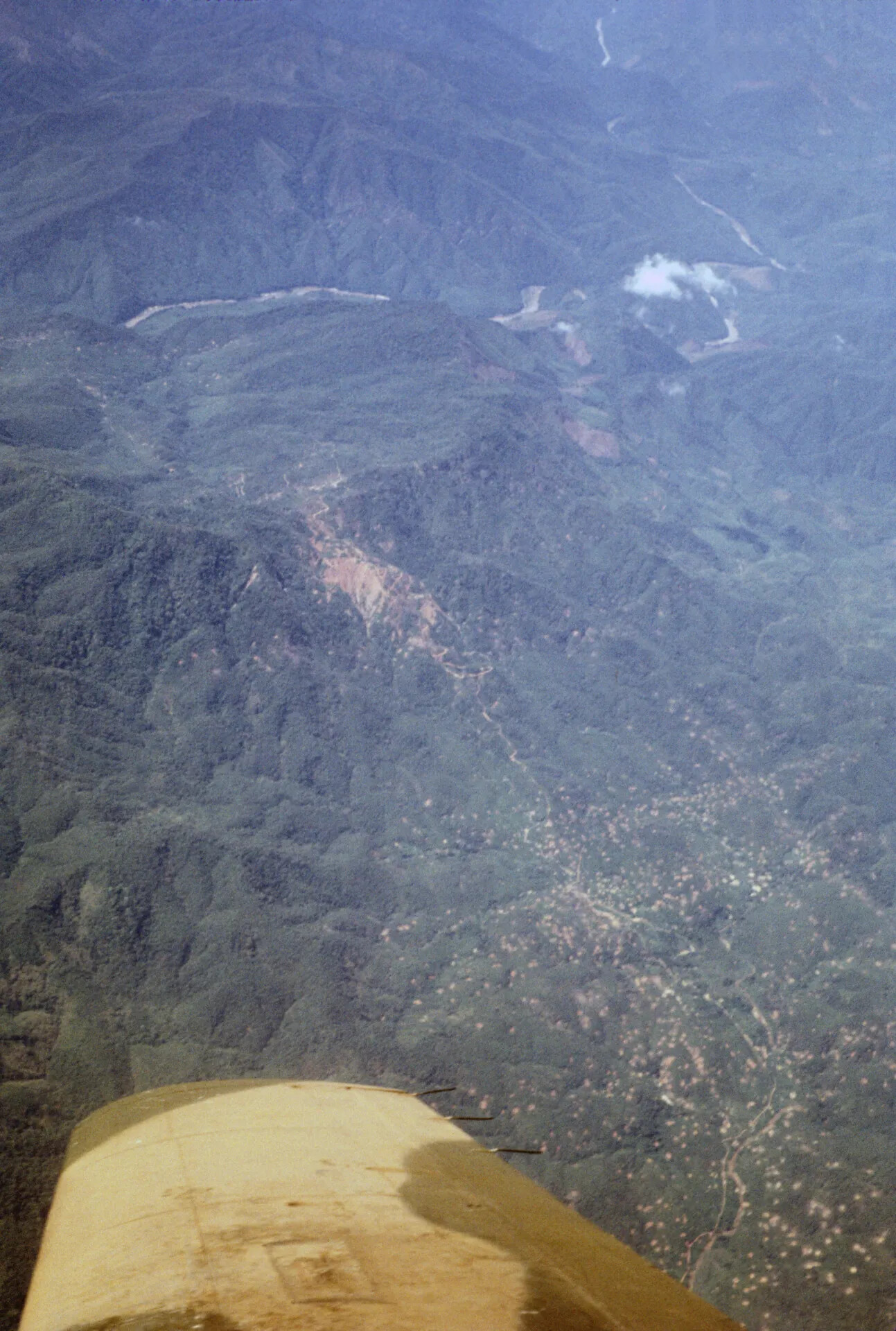 Aerial View of Mountainous Terrain and Valley Settlement, Southeast Asia, Vietnam War Era