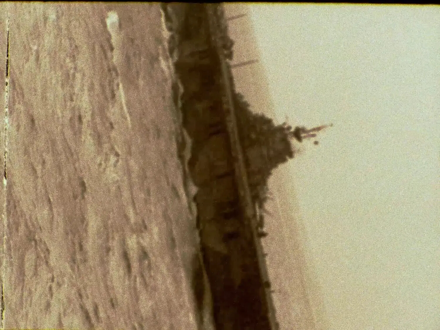 Unrotated Film Still Showing Ship Mast/Superstructure Against Sky, Pacific Theater, WWII (Francis R. Ferry Collection)