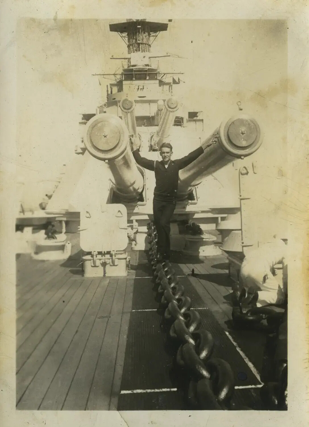 Sailor Posing Between 16-Inch Guns Aboard USS Maryland (BB-46), 1930s