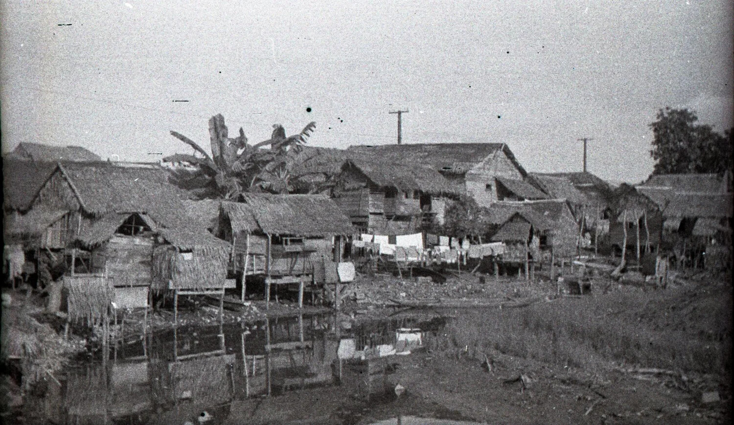 Nipa Hut Barrio Along a Waterway, Luzon, Philippines, WWII Era