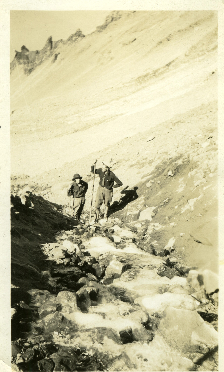 Two Hikers Ascending a Rocky Mountain Slope, Early 20th Century (Location Uncertain)