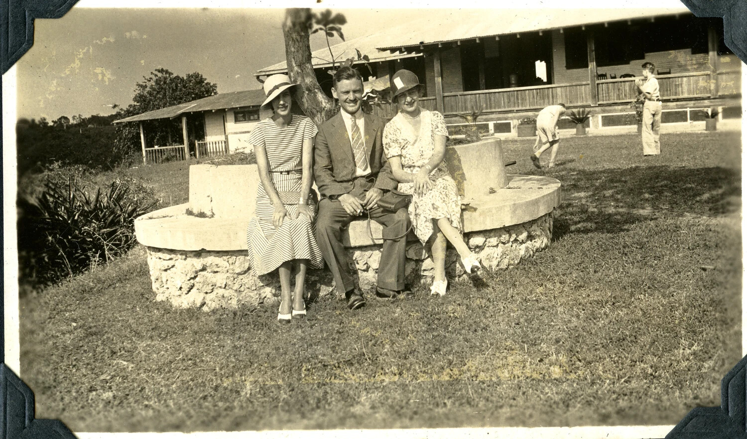 Family Group on Garden Bench at Military Post Bungalow - Jervey Signal Corps Album, 1930s