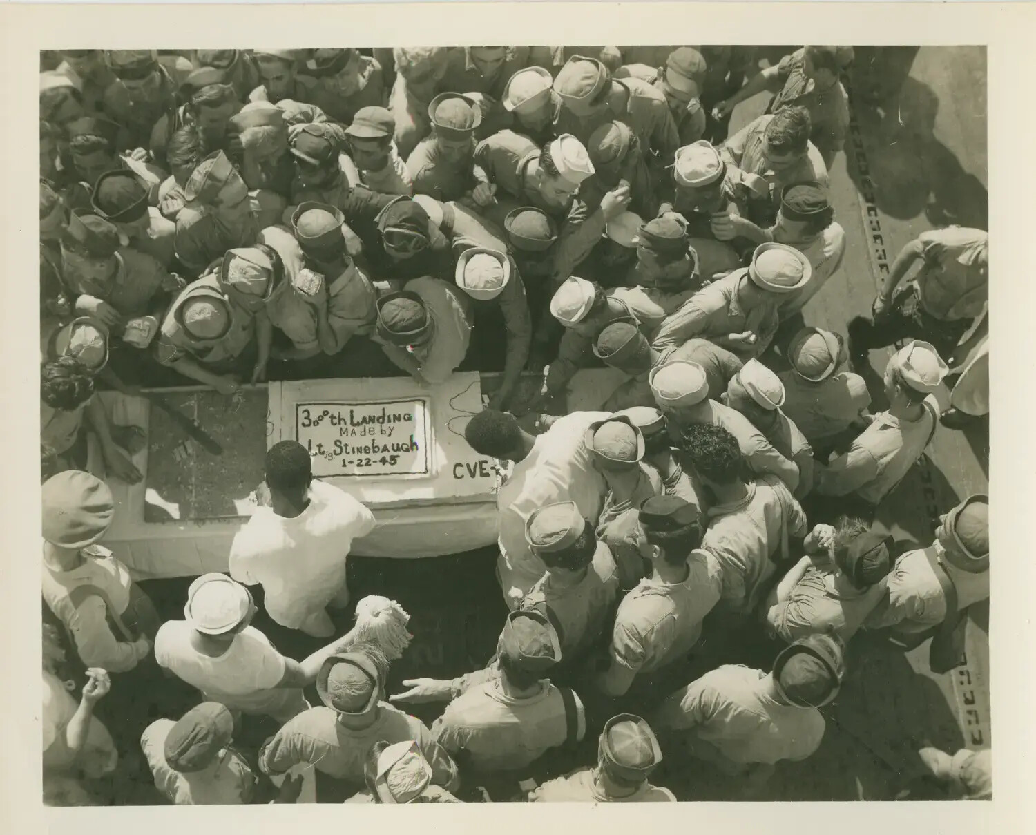Crew of USS Petrof Bay (CVE-80) Celebrating 3,000th Deck Landing, 22 January 1945